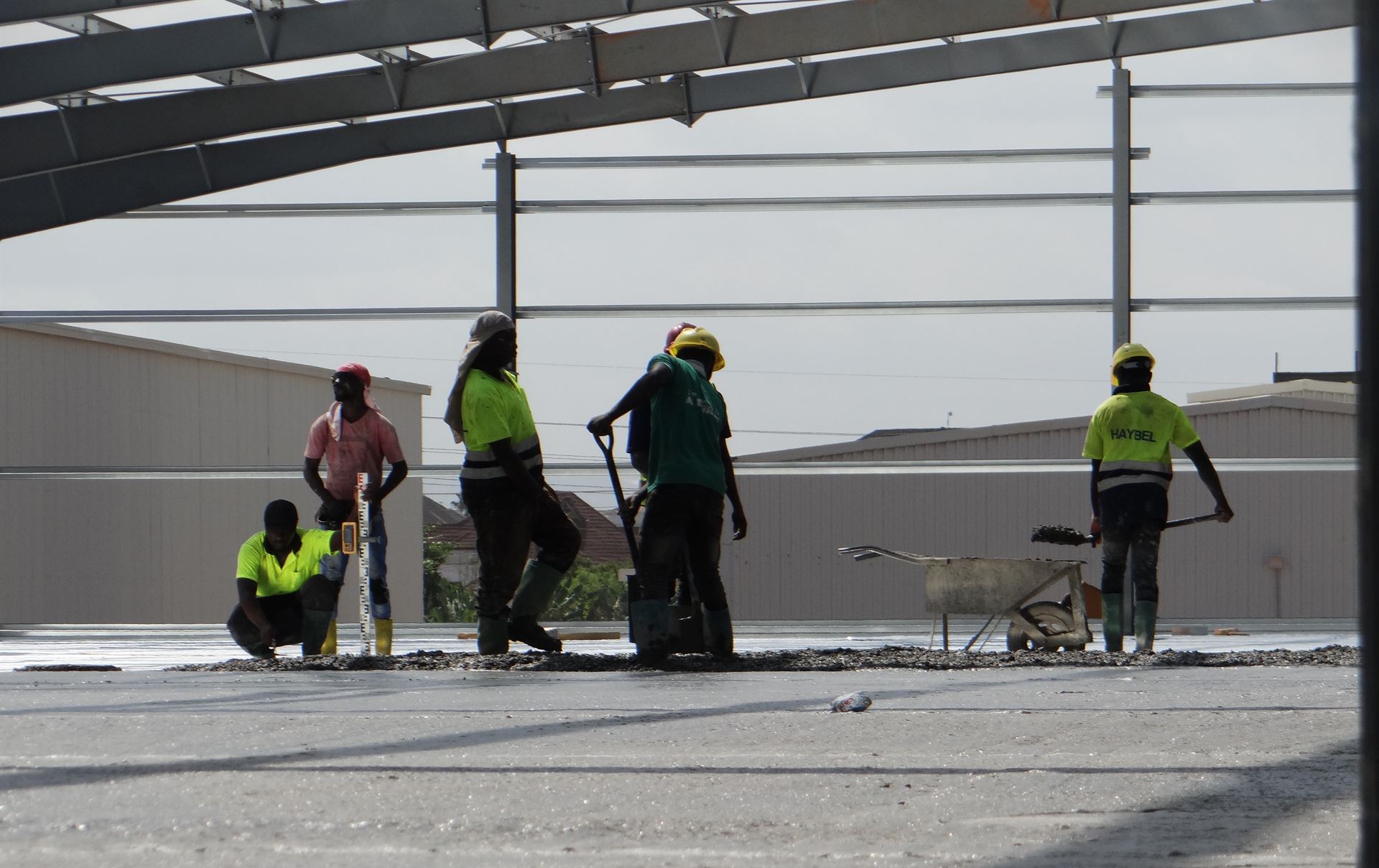 HAYBEL crew working on a slab under a steel roof structure