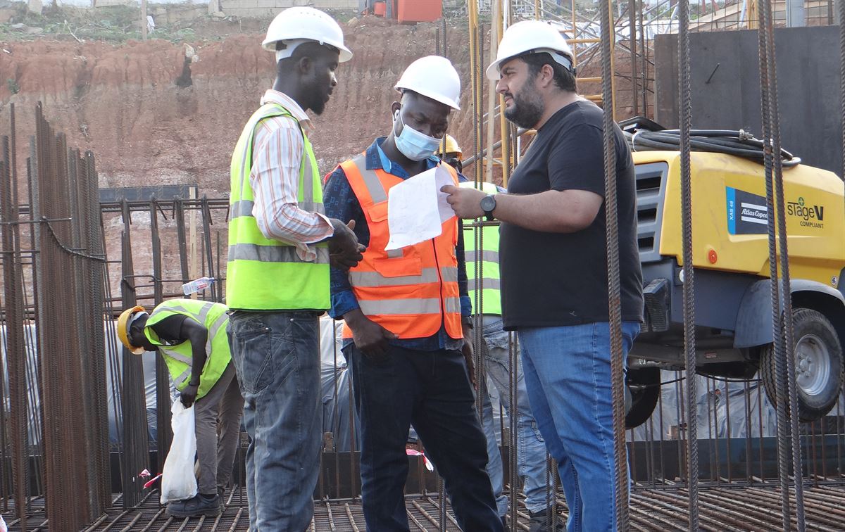 HAYBEL engineers reviewing site documents on a reinforcement mat
